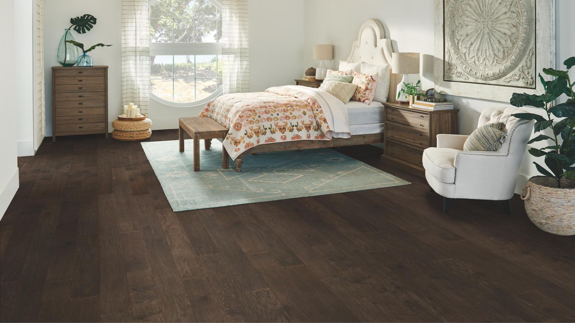 dark stained hardwood flooring in a breezy bedroom