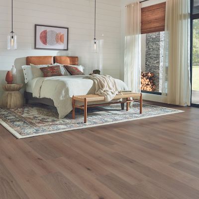 wood look laminate flooring in a rustic bedroom