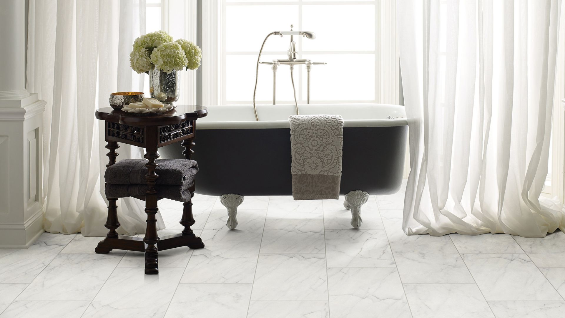 bathroom remodel with white floor tiles and a standalone tubs